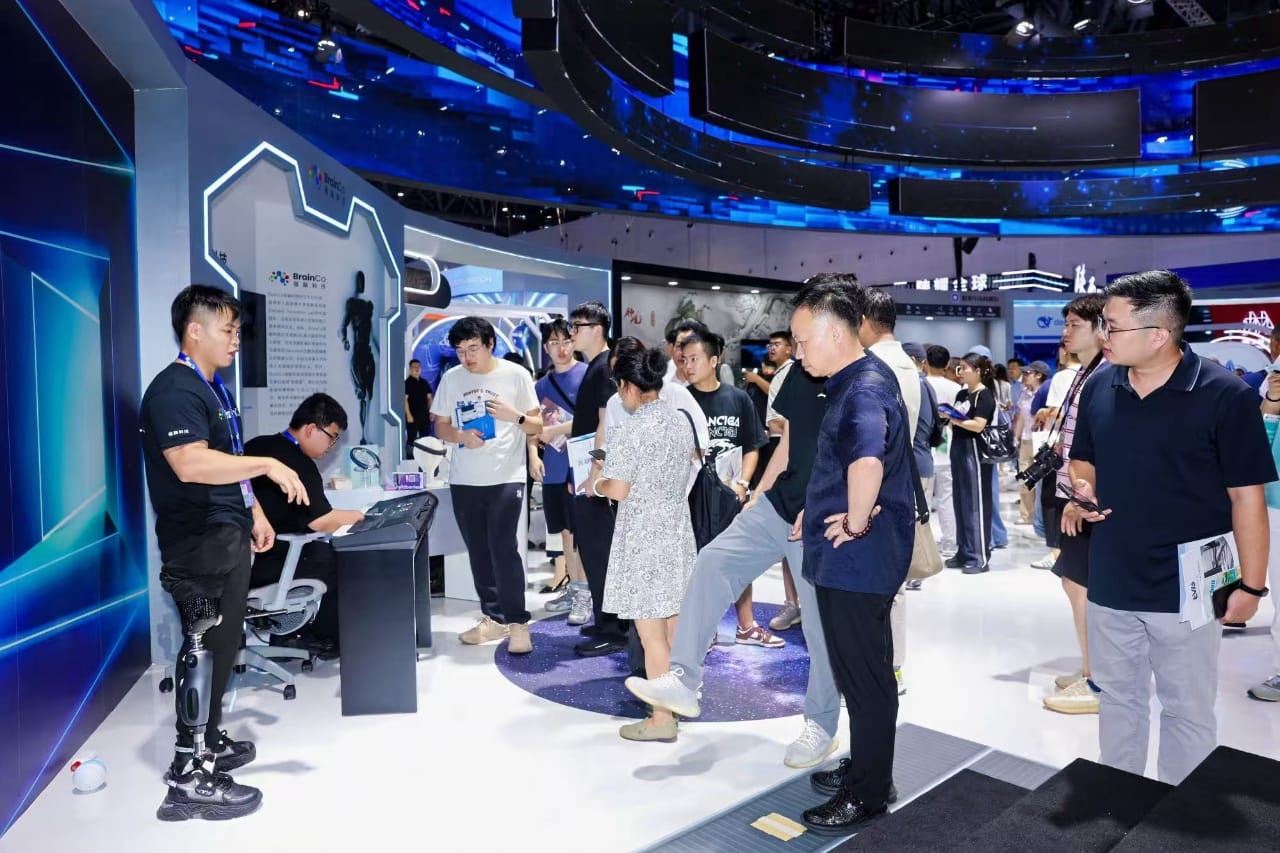 Visitors and exhibitors at a busy international trade show stand
